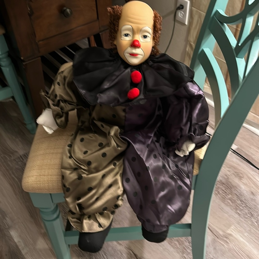 Collectible Clown with white face. Weighted bottom to sit on shelf or chair